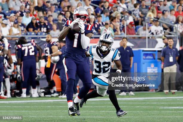 New England Patriots wide receiver DeVante Parker makes a catch in front of Carolina Panthers cornerback Tae Hayes during an NFL preseason game...