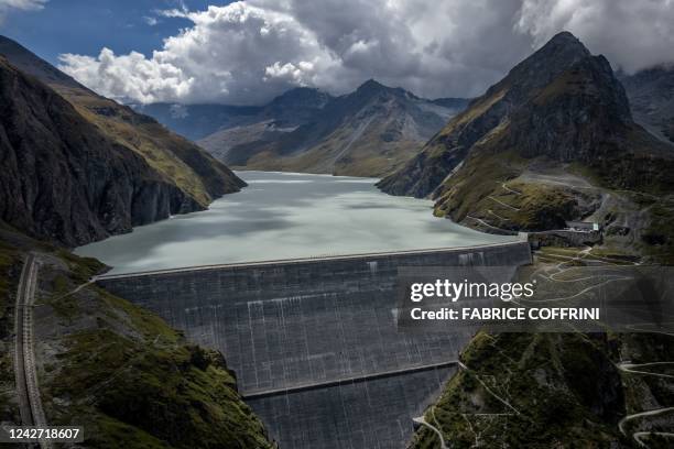 This general view shows the 285 meter high Grande Dixence dam above Heremence, western Switzerland, on August 22, 2022. - Switzerland is among the...