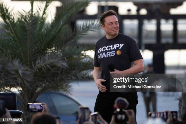 SpaceX founder Elon Musk walks on stage during a T-Mobile and SpaceX joint event on August 25, 2022 in Boca Chica Beach, Texas. The two companies...