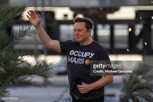 SpaceX founder Elon Musk walks on stage during a T-Mobile and SpaceX joint event on August 25, 2022 in Boca Chica Beach, Texas. The two companies...