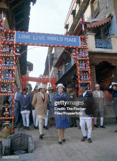 Queen Elizabeth II joins King Birendra of Nepal for a walk around Kathmandu during her five-day visit to Nepal on 20th February, 1986.