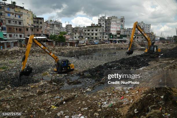 Authority is seen digging the old Buriganga river Chanel in Dhaka, Bangladesh on August 25, 2022. Buriganga river which flows by Dhaka city is one of...