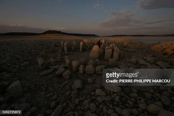 Tourists visit the Dolmen of Guadalperal megalithic site as it is now fully emerged after waters in the surrounding Valdecanas reservoir receded due...
