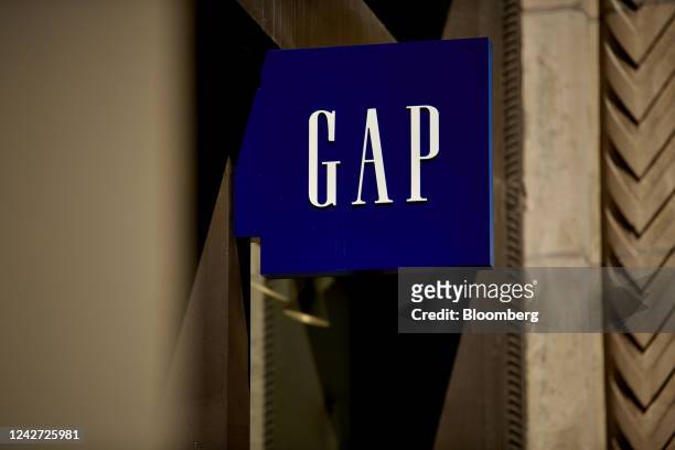 Signage outside a Gap retail store in New York, US, on Thursday, Aug. 25, 2022. Gap Inc.'s shares rose in late trading as investors took solace in...
