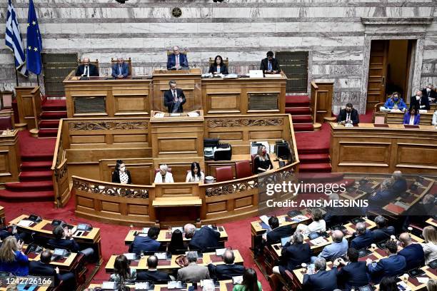 Greece's Prime Minister Kyriakos Mitsotakis attends a parliament session in Athens on August 26, 2022. - Mitsotakis called on left-wing opposition...