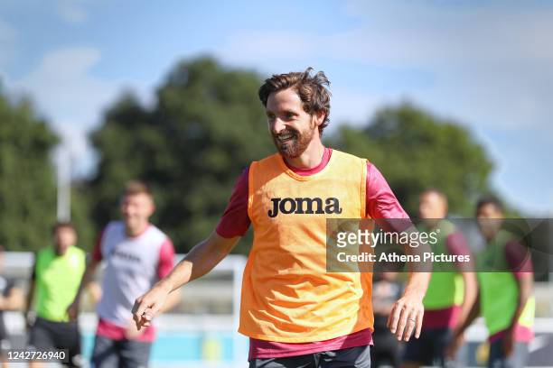 Joe Allen of Swansea City in action during the Swansea City Training Session at St George's Park on August 26, 2022 in Burton, England.