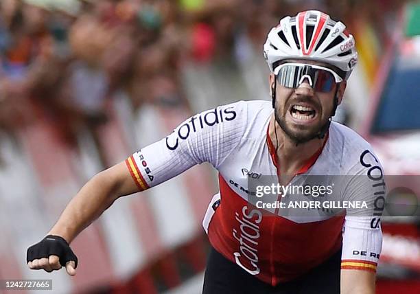 Team Cofidis' Spanish rider Jesus Herrada celebrates as he crosses the finish line in first place during the 7th stage of the 2022 La Vuelta cycling...