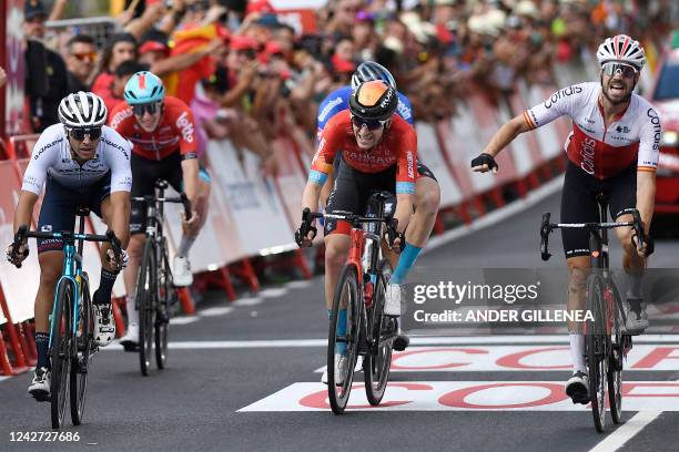 Team Cofidis' Spanish rider Jesus Herrada celebrates as he crosses the finish line in first place followed by Team Astana's Italian rider Samuele...