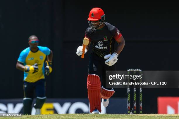 Evin Lewis of Saint Kitts & Nevis Patriots running with a broken bat during the 2022 Hero Caribbean Premier League - The 6IXTY Men's match 4 between...