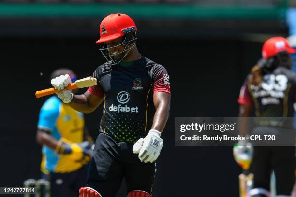 Evin Lewis of Saint Kitts & Nevis Patriots looks at his broken bat during the 2022 Hero Caribbean Premier League - The 6IXTY Men's match 4 between...