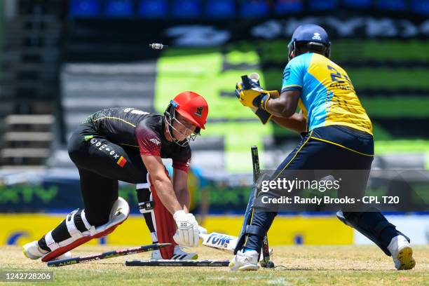 Dewald Brevis of Saint Kitts & Nevis Patriots stumped by Johnson Charles of Saint Lucia Kings during the 2022 Hero Caribbean Premier League - The...