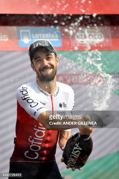 Team Cofidis' Spanish rider Jesus Herrada celebrates on the podium winning the 7th stage of the 2022 La Vuelta cycling tour of Spain, a 190 km race...