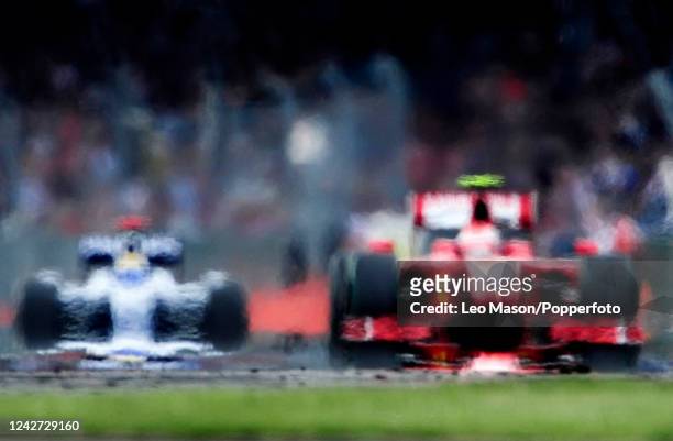 An abstract creative impression of two Formula One cars on the track during the British Grand Prix at Silverstone on June 21, 2009 in Northampton,...