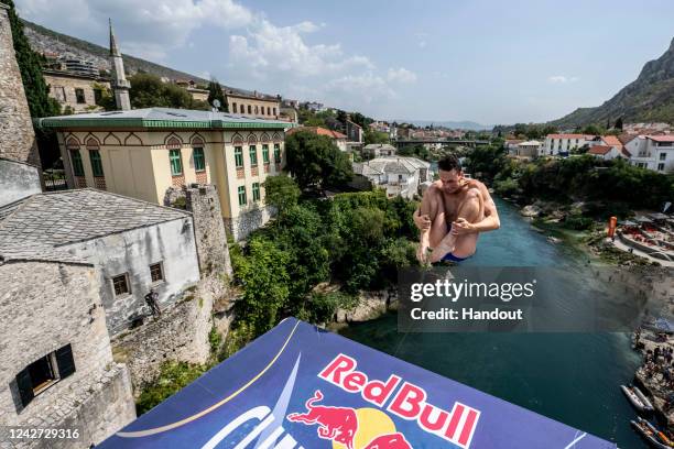 In this handout image provided by Red Bull, Aidan Heslop of the UK dives from the 27 metre platform on Stari Most during the second competition day...