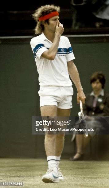 American tennis player John McEnroe reacts during play to win the final of the Men's Singles tournament against Bjorn Borg of Sweden, 4-6, 7-6, 7-6,...