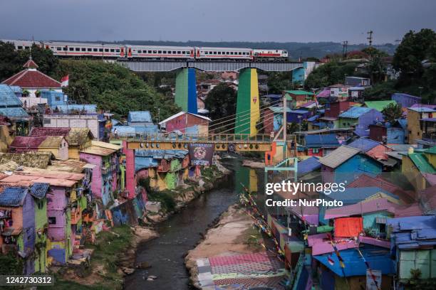 Train bound for Jakarta city crosses a bridge in a tourist area in Malang city, East Java, Indonesia, on August 26, 2022. The Indonesian government...