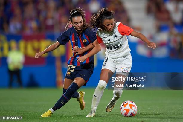 Ona Baradad of Barcelona and Ines Belloumou of Montpellier compete for the ball during the Womens Joan Gamper Trophy match between FC Barcelona and...