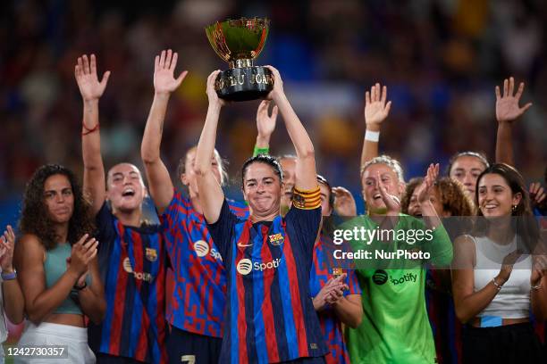 Marta Torrejon of Barcelona lifts the trophy after winning with her team the Womens Joan Gamper Trophy match between FC Barcelona and Montpellier at...