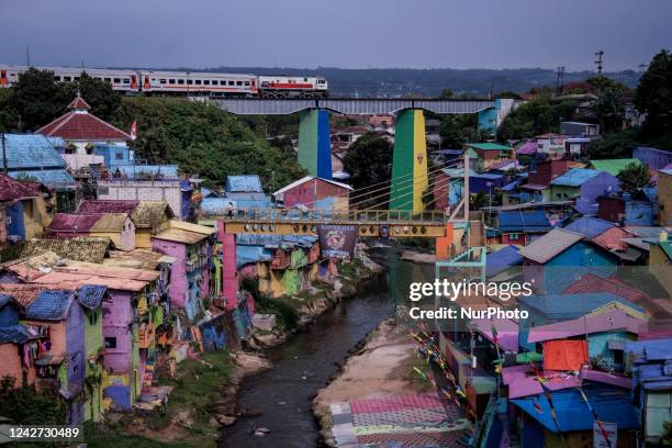 Train bound for Jakarta city crosses a bridge in a tourist area in Malang city, East Java, Indonesia, on August 26, 2022. The Indonesian government...