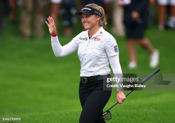 Brooke Henderson of Canada waves to fans on the 18th fairway during the second round of the CP Women's Open at Ottawa Hunt and Golf Club on August...