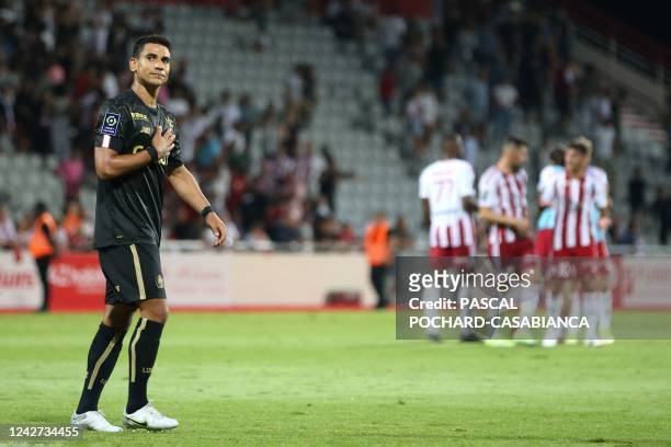 Lille's French midfielder Benjamin Andre thanks Ajaccio's supporters at the end of the French L1 football match between AC Ajaccio and Lille at Stade...