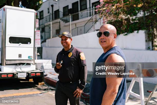 Los Angeles, CA A double for Vin Diesel checks in with production security outside the set of Fast and Furious on Friday, Aug. 26, 2022 in Los...