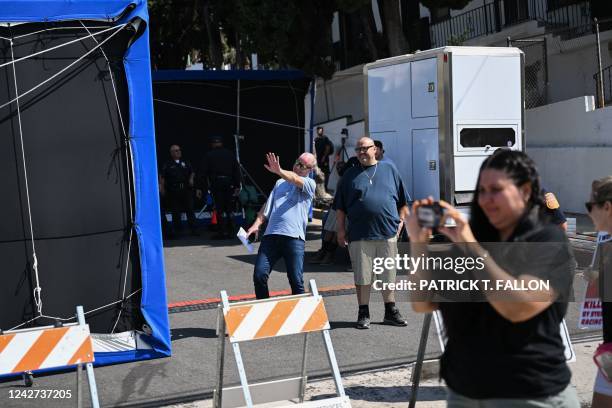 Person waves at protesters from a film production area as local residents and supporters of the group Street Racing Kills protest the increase in...