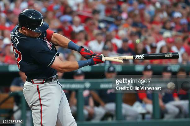 Austin Riley of the Atlanta Braves hits into a ground out against the St. Louis Cardinals in the first inning at Busch Stadium on August 26, 2022 in...