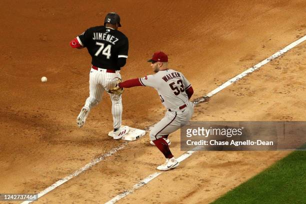 Eloy Jimenez of the Chicago White Sox beats the throw in front of Christian Walker of the Arizona Diamondbacks in the sixth inning at Guaranteed Rate...