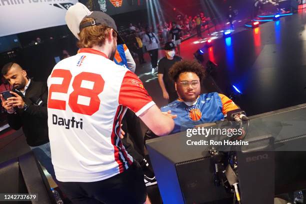 Dayfri of Wizards District Gaming shakes hands with Radiant of Knicks Gaming after the 2022 NBA 2K 5v5 Playoff Championship Eastern Conference Finals...