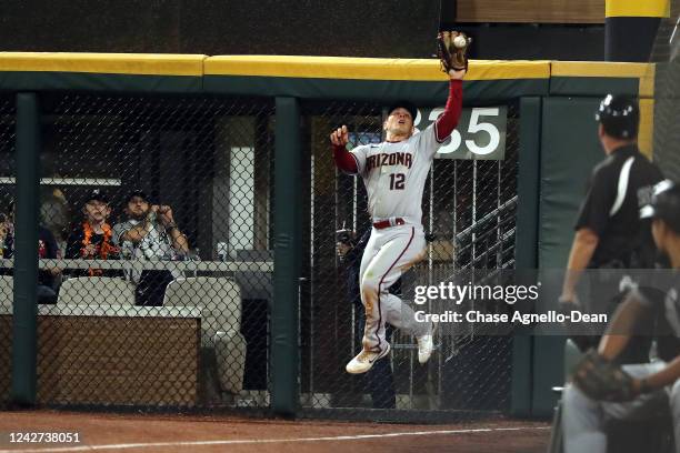 Daulton Varsho of the Arizona Diamondbacks makes a leaping catch in right field against the Chicago White Sox at Guaranteed Rate Field on August 26,...