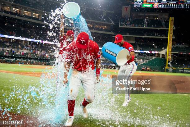 Mark Mathias of the Texas Rangers is doused by gatorade after winning a game against the Detroit Tigers at Globe Life Field on August 26, 2022 in...