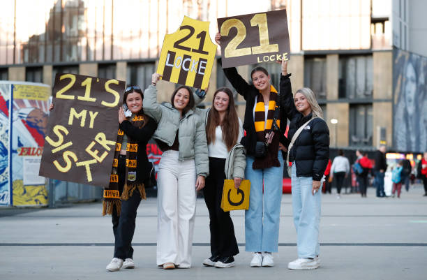 Friends and family of Sophie Locke of the Hawks are seen during the 2022 S7 AFLW Round 01 match between the Essendon Bombers and the Hawthorn Hawks...
