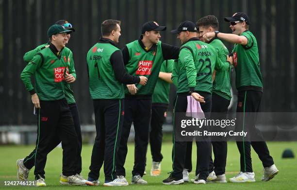 Tyrone , United Kingdom - 27 August 2022; Lisburn players congratulate Adam Berry after catching the wicket of Ross Adair of CIYMS during the Clear...