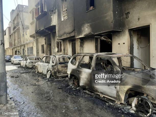 General view of the damaged cars following the clash between two armed groups operating in the Qasr bin Ghashir and Al-Sarim regions of Tripoli,...