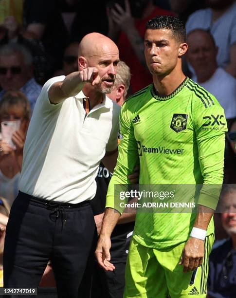 Manchester United's Dutch manager Erik ten Hag directs substitute Manchester United's Portuguese striker Cristiano Ronaldo during the English Premier...