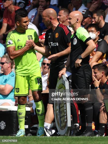 Manchester United's Brazilian midfielder Casemiro is introduced as a substitute during the English Premier League football match between Southampton...