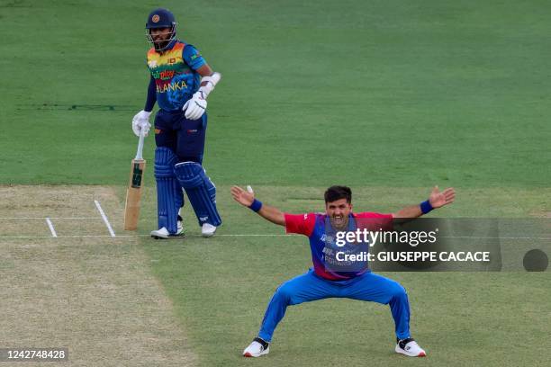 Afghanistan's Fazalhaq Farooqi successfully appeals for a LBW dismissal against Sri Lanka's Kusal Mendis during the Asia Cup Twenty20 International...