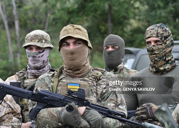 New members of the Dzhokhar Dudayev Chechen volunteer battalion take part in a training session in the Kyiv region on August 27 amid the Russian...