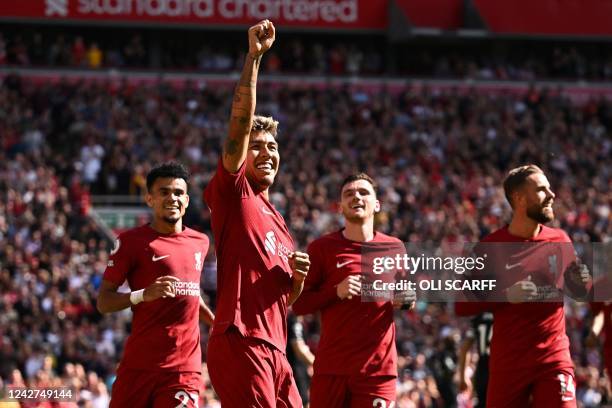 Liverpool's Brazilian striker Roberto Firmino celebrates after scoring their fourth goal during the English Premier League football match between...