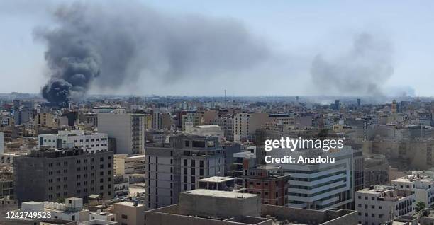 Smoke rises after clashes between two rival militias operating between Qaser Ben Ghashir and Al-Sarim regions, in Tripoli, Libya on August 27, 2022....