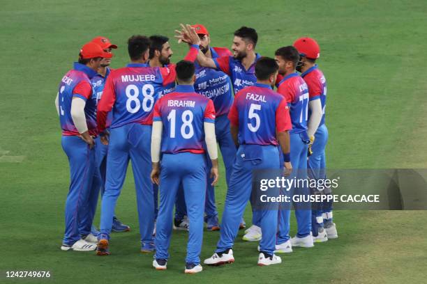 Afghanistan's Mujeeb Ur Rahman celebrates with teammates after dismissing Sri Lanka's Danushka Gunathilaka during the Asia Cup Twenty20 International...