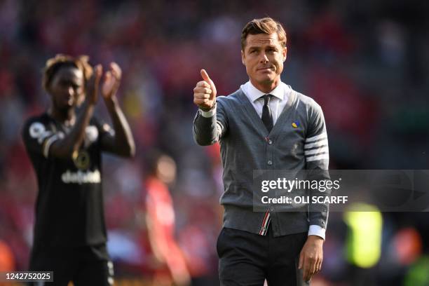 Bournemouth's English head coach Scott Parker gestures to supporters after the English Premier League football match between Liverpool and...