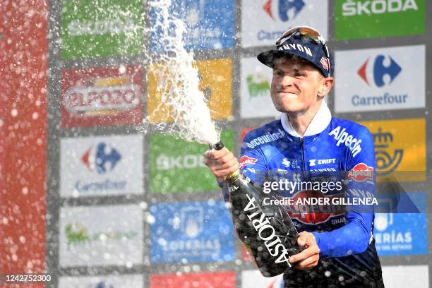 Team Alpecin-Deceuninck's Australian rider Jay Vine celebrates on the podium his second stage victory after winning the 8th stage of the 2022 La...