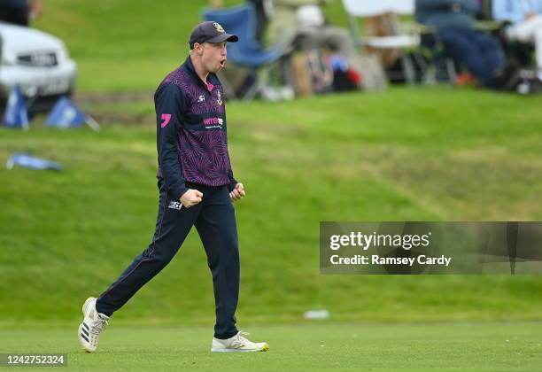 Tyrone , United Kingdom - 27 August 2022; Jack Beattie of CIYMS celebrates catching the wicket of Faiz Fazal of Lisburn during the Clear Currency...