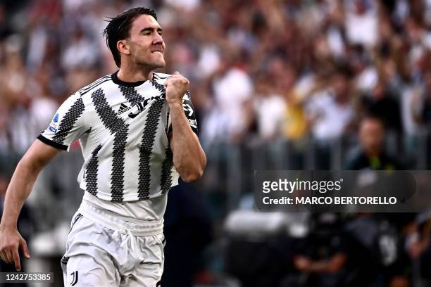 Juventus' Serbian forward Dusan Vlahovic celebrates after opening the scoring during the Italian Serie A football match between Juventus and AS Roma...