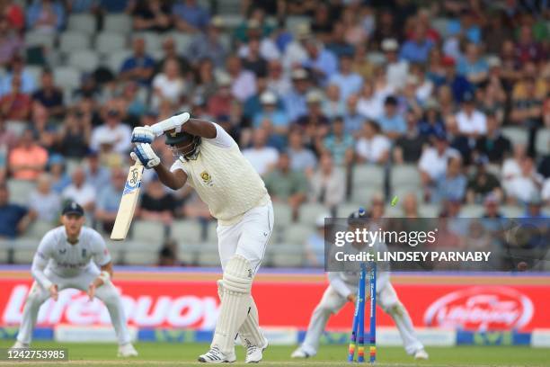 South Africa's Lungi Ngidi is bowled by England's Ollie Robinson as England wrap up the South African tail on day 3 of the second Test match between...