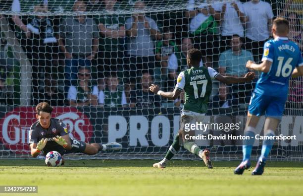 Bolton Wanderers' James Trafford beats Plymouth Argyle's Bali Mumba to the ball during the Sky Bet League One between Plymouth Argyle and Bolton...