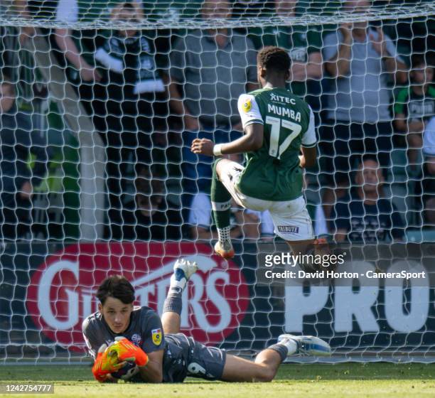 Bolton Wanderers' James Trafford beats Plymouth Argyle's Bali Mumba to the ball during the Sky Bet League One between Plymouth Argyle and Bolton...