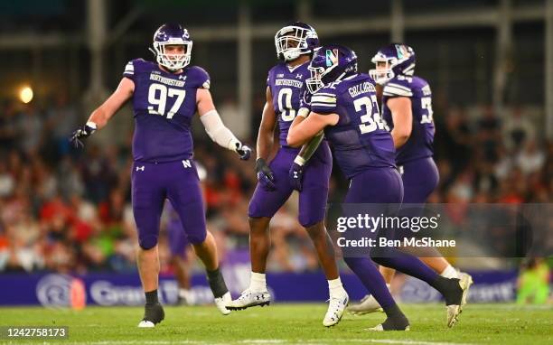 Dublin , Ireland - 27 August 2022; Northwestern Wildcats players celebrate after defensive back Coco Azema made an intercepting catch during the Aer...